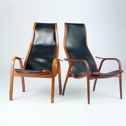 Appraisal: Yngve Ekstrom pair of teak lounge chairs with black leather