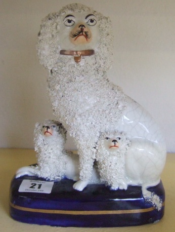 Appraisal: A Staffordshire poodle group th century modelled as a bitch