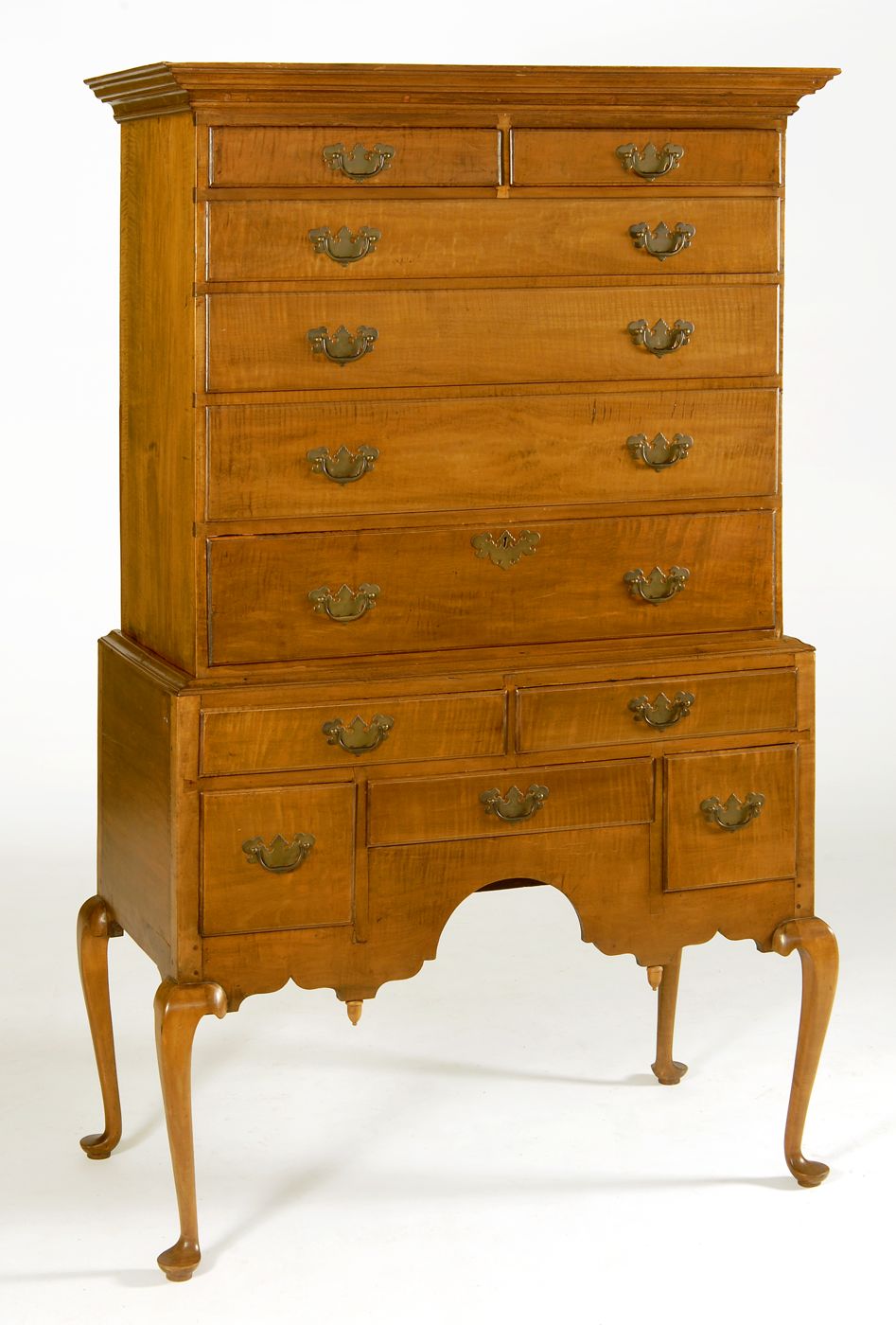 Appraisal: ANTIQUE AMERICAN HIGHBOY th CenturyIn tiger maple and other woods