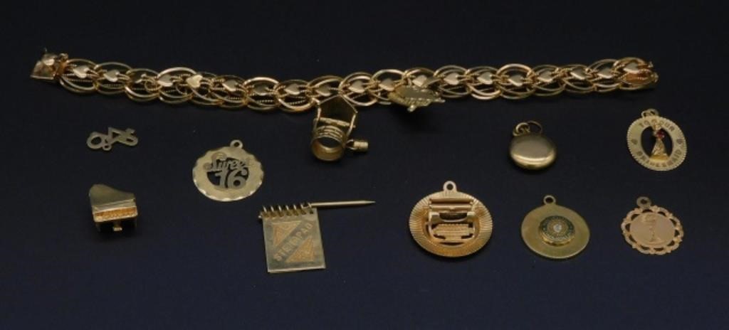 Appraisal: charms are not gold Bracelet is long and is marked