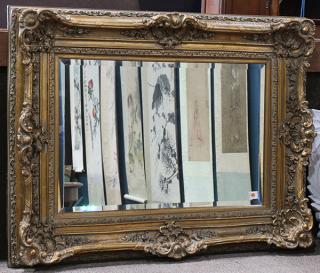 Appraisal: Rococo style giltwood mirror having a floral and shell carved