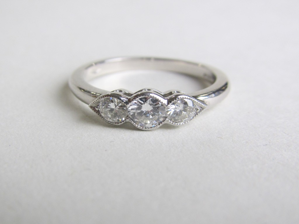 Appraisal: Platinum diamond three stone ring with central milligrain set brilliant