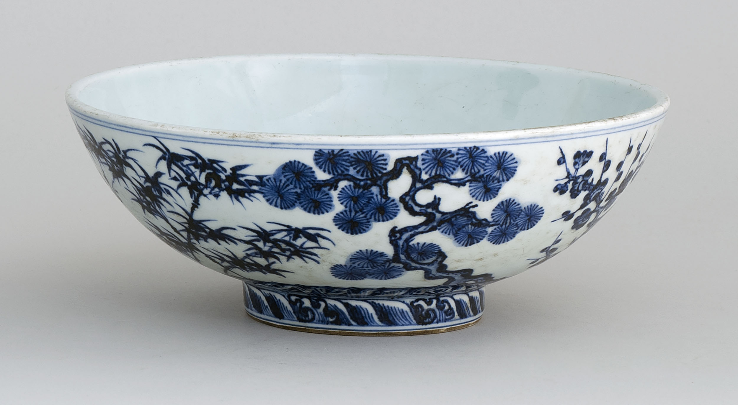 Appraisal: BLUE AND WHITE PORCELAIN BOWL Ming StyleWith Three Friends pine