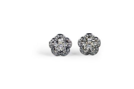 Appraisal: A pair of diamond floral cluster earrings each claw set