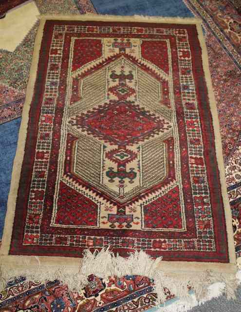 Appraisal: A HAMADAN RUST GROUND RUG with central medallion x and