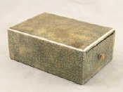 Appraisal: A shagreen covered box with compartmentalised wooden drawer probably for