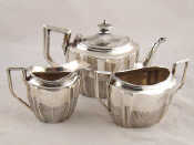 Appraisal: A late Victorian silver three piece bachelor's teaset curve panelled