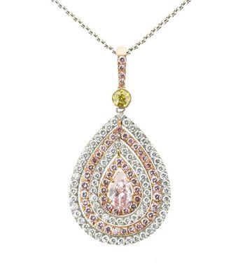 Appraisal: A pink white and yellow diamond pendant Centred with a