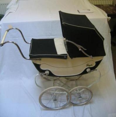 Appraisal: A Royale doll's perambulator coach built with blue canvas hood