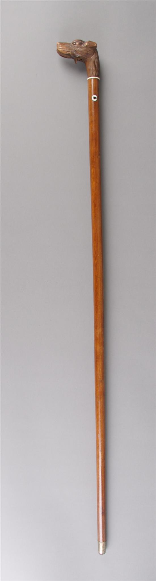 Appraisal: A Walking Stick with Carved Dog Handle Height inches