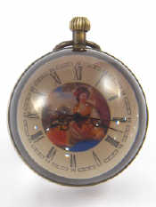 Appraisal: An anodised brass mounted glass ball button wind clock with