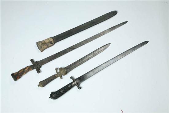 Appraisal: THREE HUNTING SWORDS European late th-early th century Two with