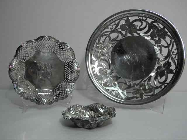 Appraisal: Three sterling silver dishes Includes a small '' floral repousse