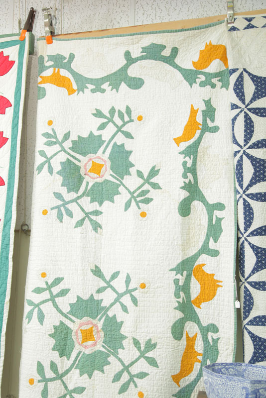 Appraisal: APPLIQUE QUILT Embellished with a floral pattern in shades of