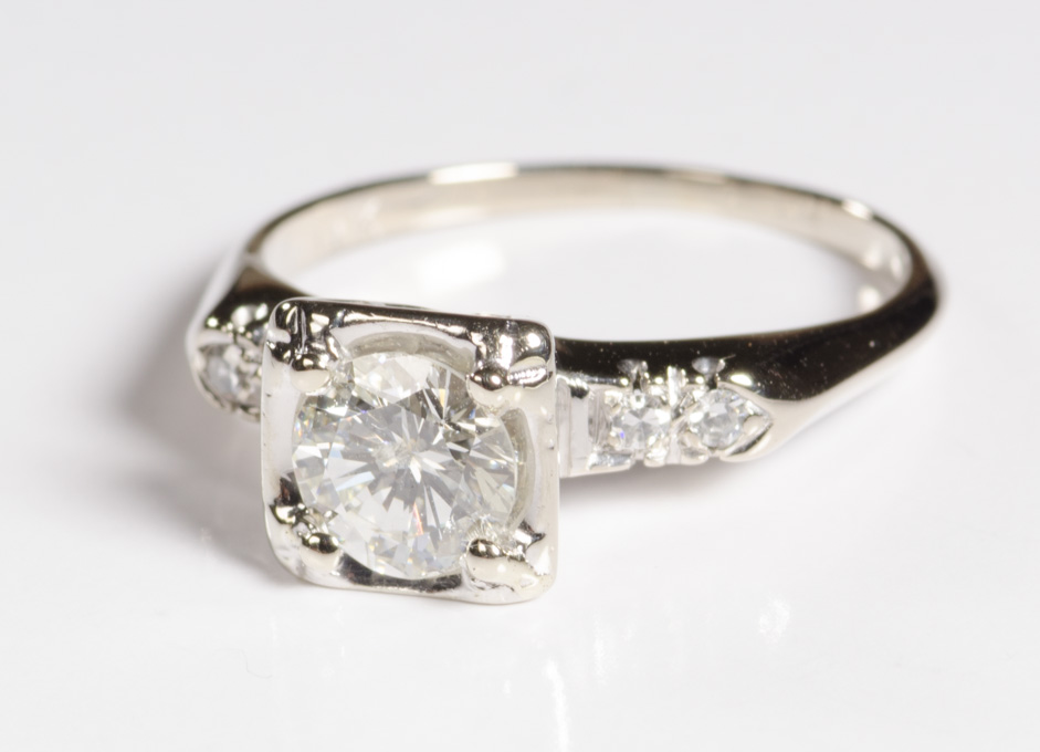 Appraisal: DIAMOND AND FOURTEEN KARAT WHITE GOLD RING with two round-cut