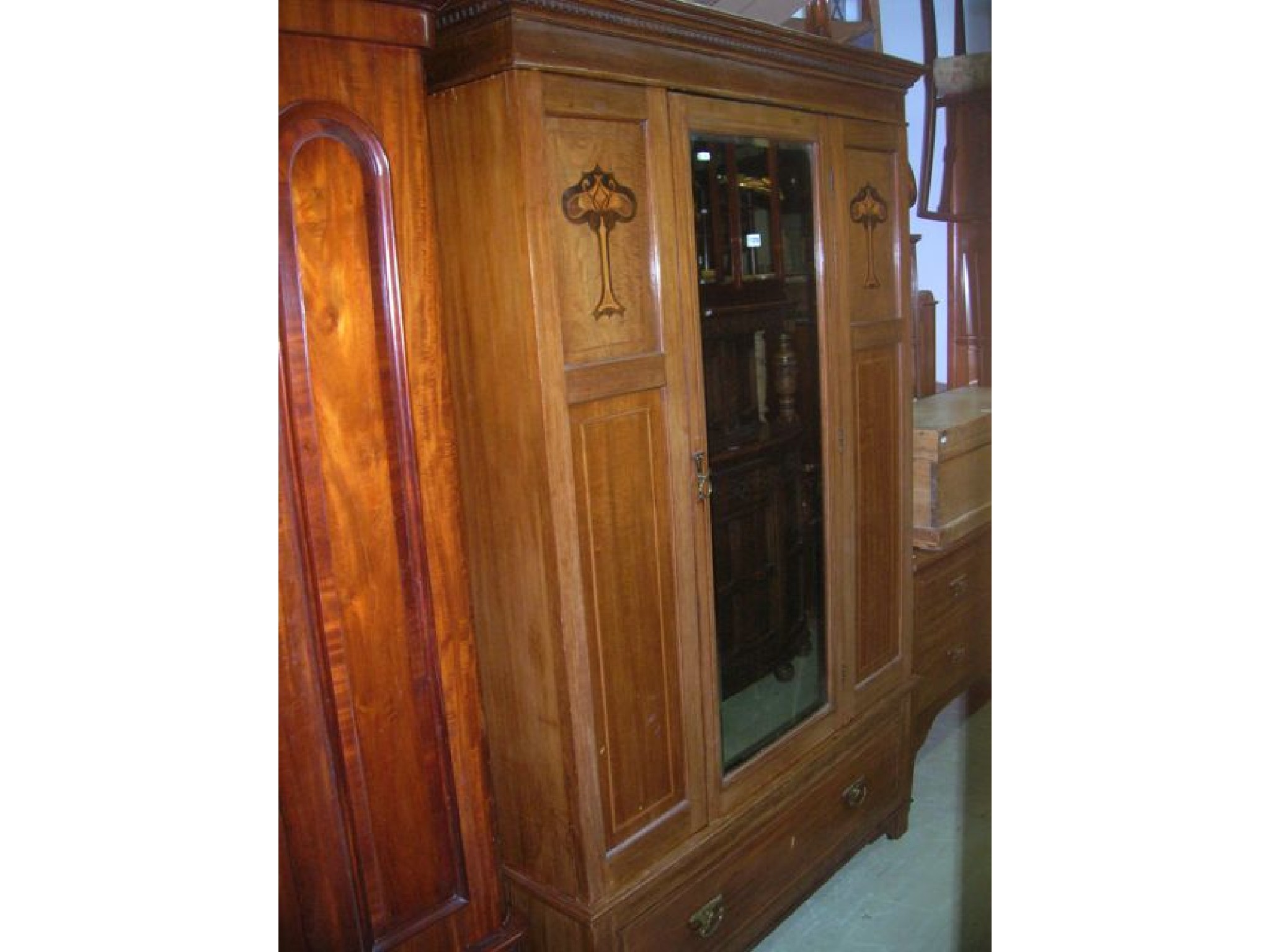 Appraisal: An inlaid Edwardian mahogany bedroom pair comprising wardrobe with stepped