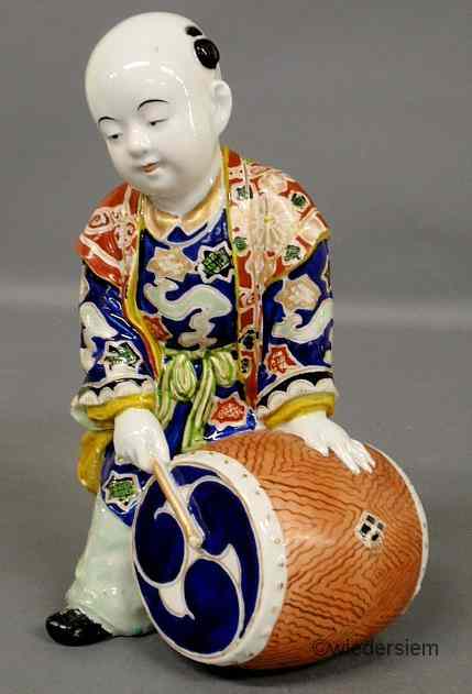 Appraisal: Chinese export porcelain figure of a musician beating a drum