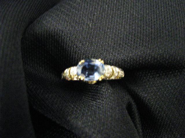 Appraisal: Sapphire Diamond Ring oval rich blue carat gem surrounded by