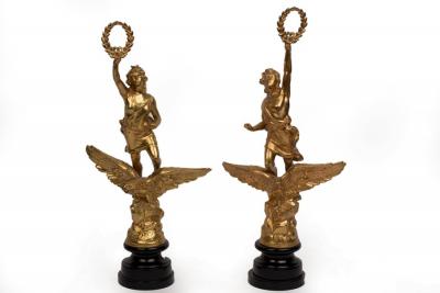 Appraisal: A pair of gilt metal Classical figures each holding a