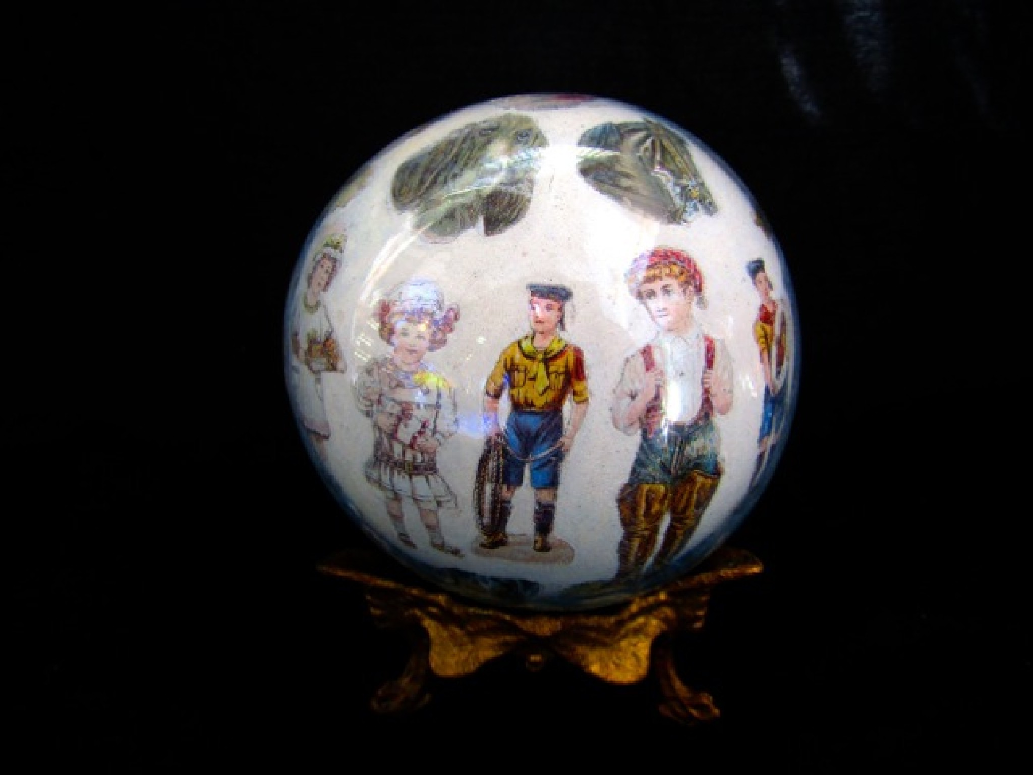 Appraisal: A late th century decalcomania glass ball filled and decorated