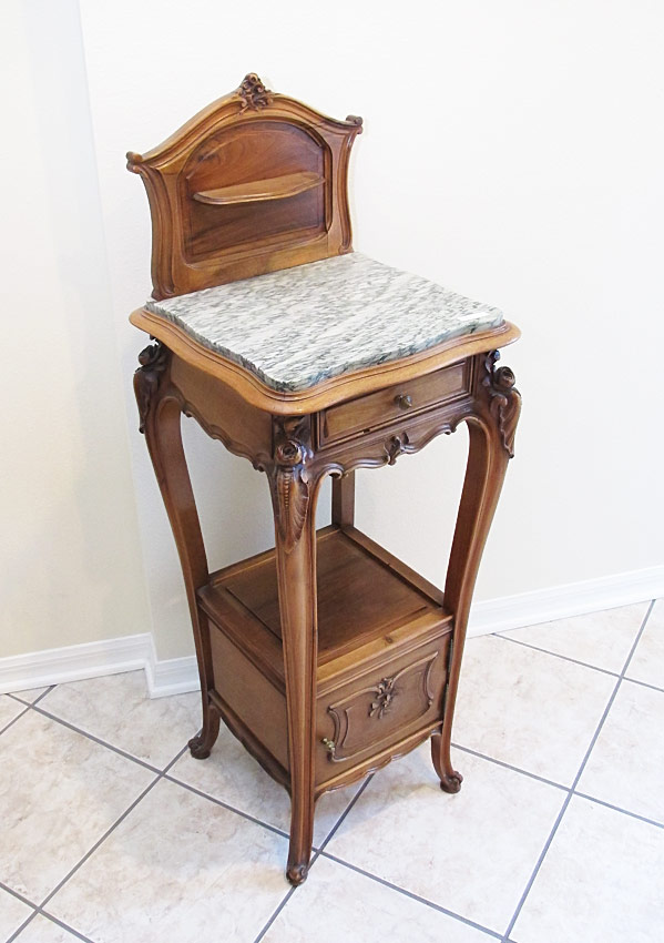 Appraisal: TALL FRENCH WALNUT MARBLE TOP SIDE TABLE Carved and shaped