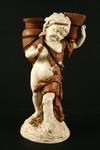 Appraisal: FIGURINE - Circa Royal Rudolstadt figurine of standing putti holding