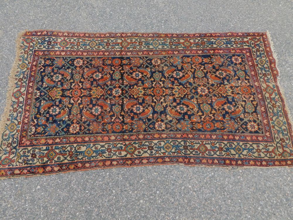 Appraisal: ANTIQUE PERSIAN SCATTER RUG Antique Persian scatter rug with navy