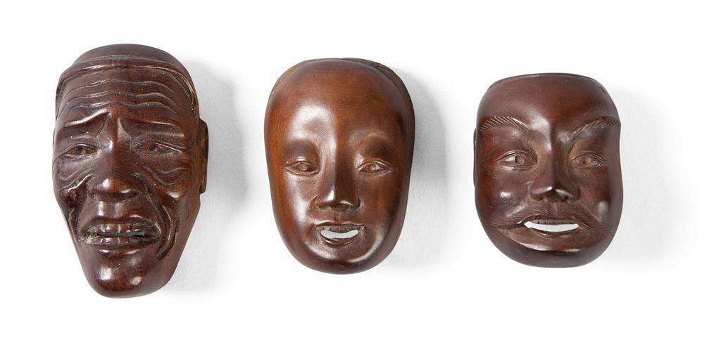 Appraisal: THREE JAPANESE CARVED WOOD MASK NETSUKE EDO MEIJI PERIOD one