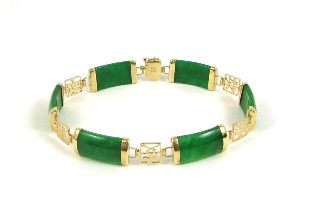 Appraisal: JADE AND FOURTEEN KARAT GOLD BRACELET with six green jade