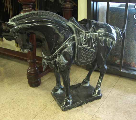 Appraisal: CHINESE TANG STYLE HORSE SCULPTURE black marble traditional standing pose