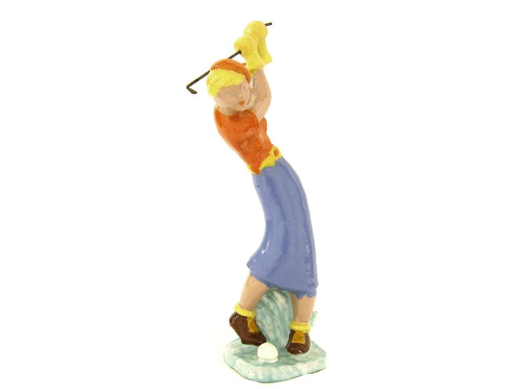 Appraisal: Hungarian glazed terracotta figure of a female golfer modelled in