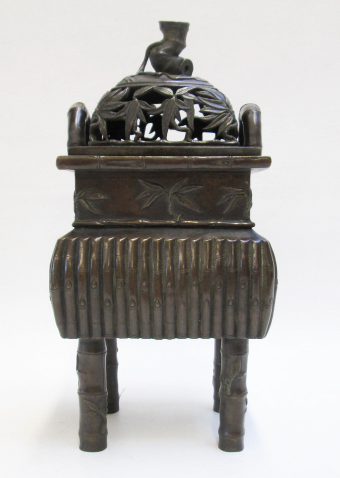 Appraisal: CHINESE BRONZE CENSER a rectangular -leg vessel with original pierced