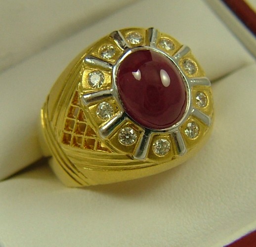 Appraisal: RUBY DIAMOND AND FOURTEEN KARAT GOLD RING centering an oval