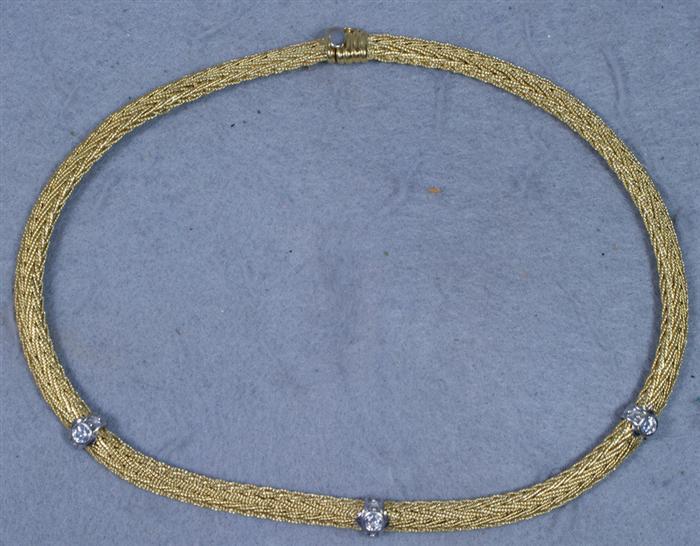 Appraisal: K YG braided choker necklace with diamond set WG mounts