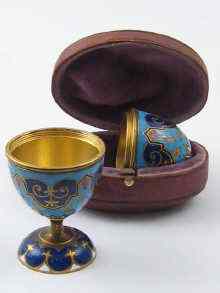 Appraisal: A pair of Russian champleve enamelled brass travelling eggcups the