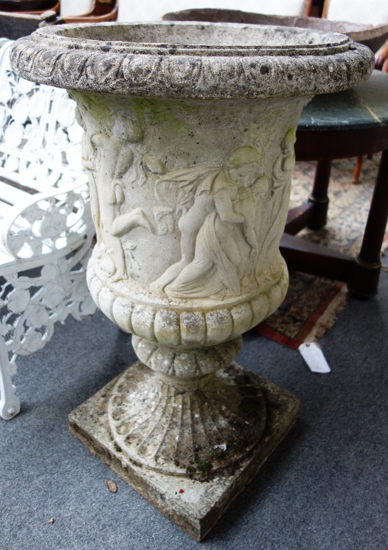 Appraisal: A pair of composition stone campana urns the bodies relief