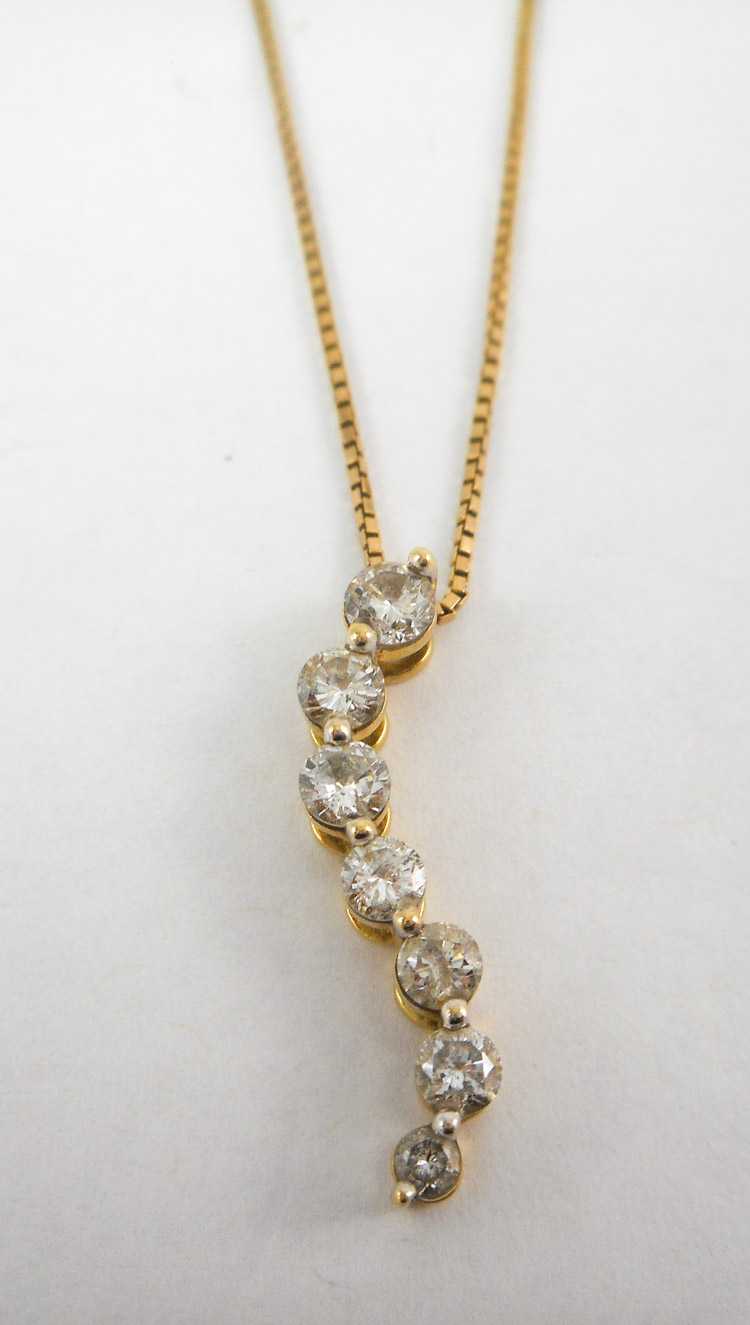 Appraisal: DIAMOND AND FOURTEEN KARAT GOLD PENDANT NECKLACE suspended on a