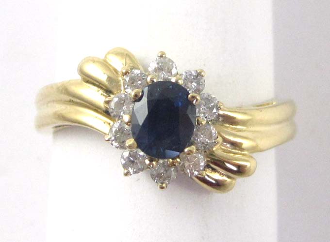 Appraisal: SAPPHIRE DIAMOND AND FOURTEEN KARAT GOLD RING with ten round-cut