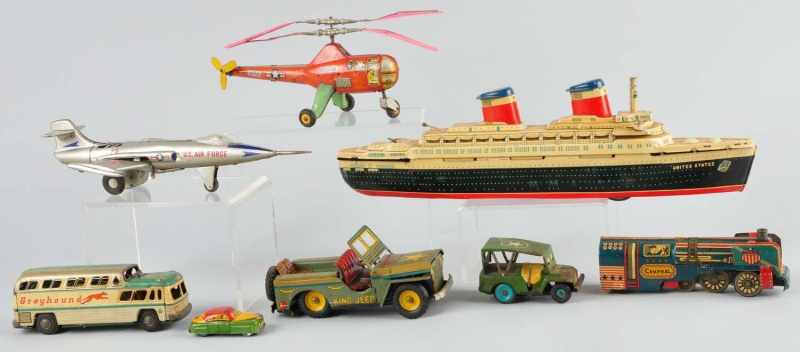 Appraisal: Lot of Assorted Tin Vehicle Toys Description Japanese Includes battery-operated