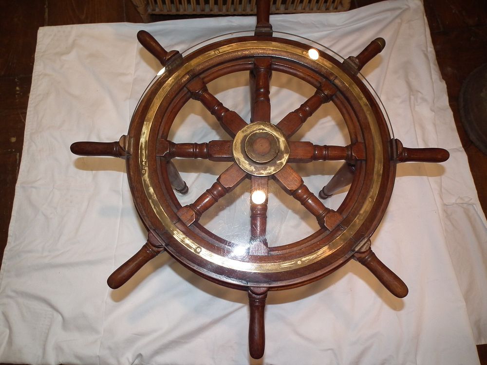 Appraisal: SHIPS WHEEL TABLE Old ship's wheel occasional table with glass