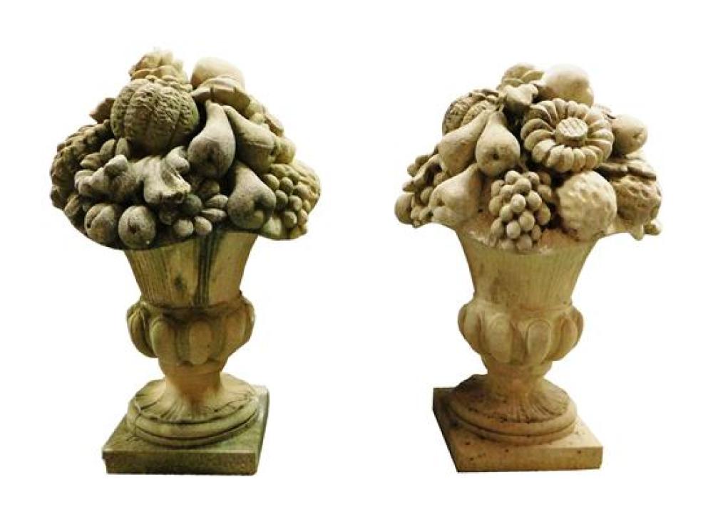 Appraisal: GARDEN Pair of cement fruit and flower arrangements in urn