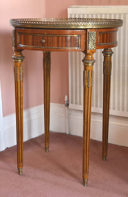 Appraisal: A FRENCH FAN INLAID CIRCULAR OCCASIONAL TABLE with brass gallery