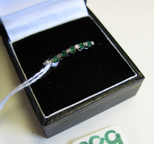 Appraisal: EMERALD DIAMOND AND FOURTEEN KARAT WHITE GOLD RING set with