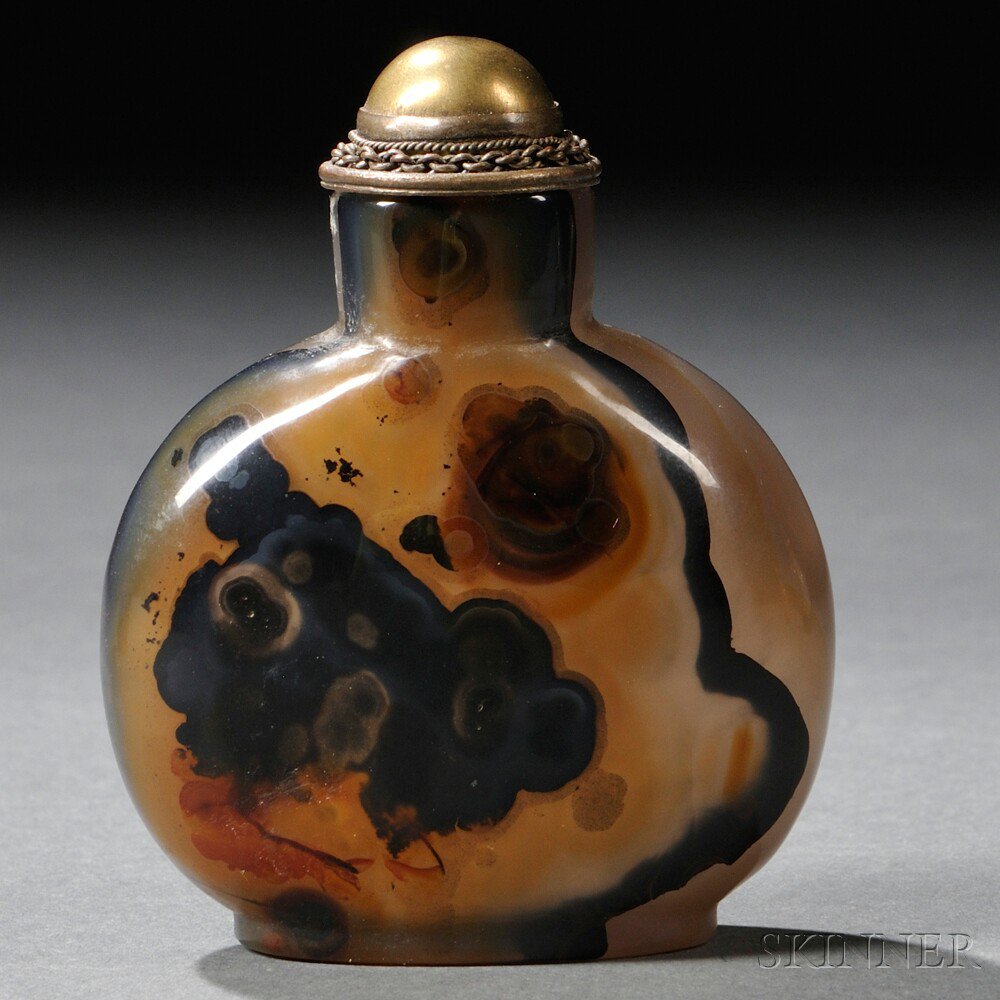 Appraisal: Agate Snuff Bottle with Metalwork Stopper China flattened round form