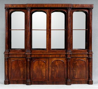 Appraisal: Egyptian Revival classical breakfront highly figured mahogany veneers throughout with