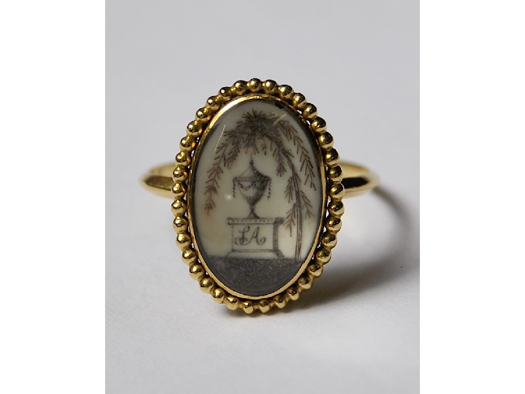 Appraisal: George III oval mourning ring featuring singed hair work on