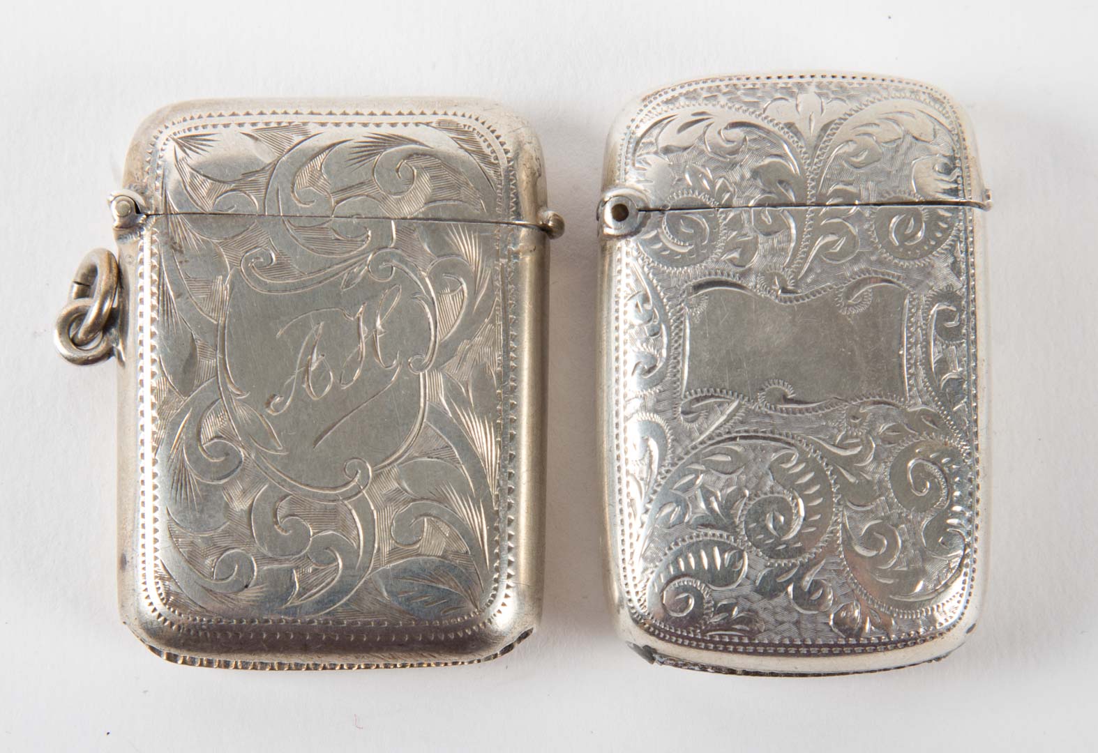 Appraisal: Two English engraved sterling silver match safes Birmingham early th