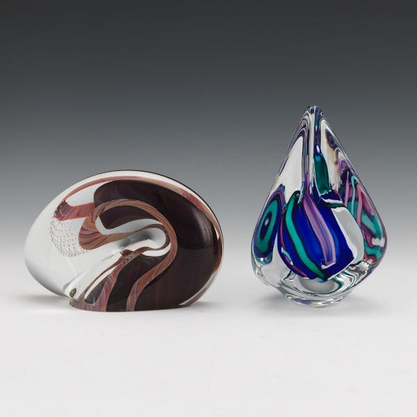 Appraisal: TWO GLASS PAPERWEIGHTS One clear with swirled shimmery purple interior