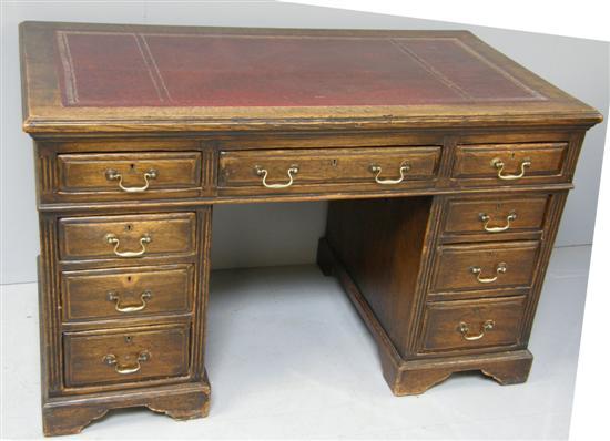 Appraisal: Oak pedestal desk by Maple Co with nine drawer configuration