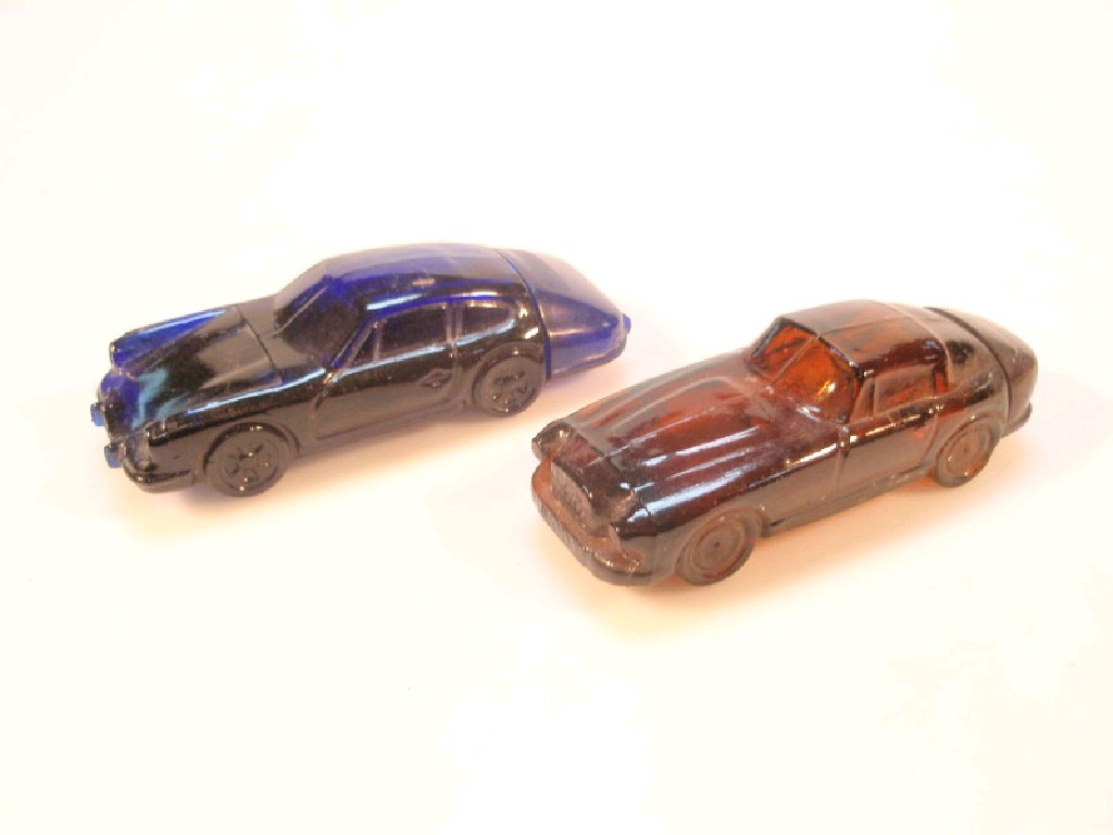 Appraisal: Two Avon glass after shave bottles shaped as a Porsche